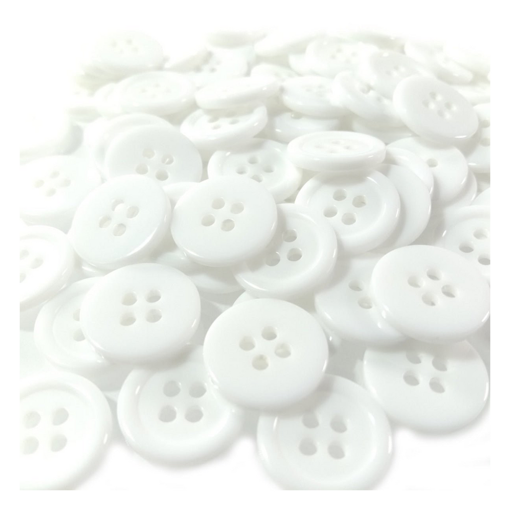 Plain White Ridged 15mm 4-Hole Buttons – 100pcs – White buttons scattered on a white background