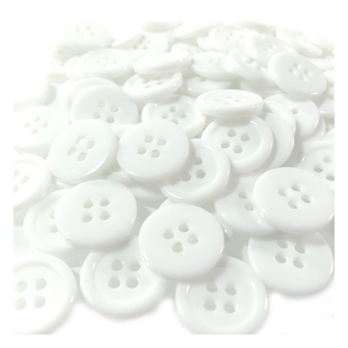 Plain White Ridged 15mm 4-Hole Buttons – 100pcs – White buttons scattered on a white background