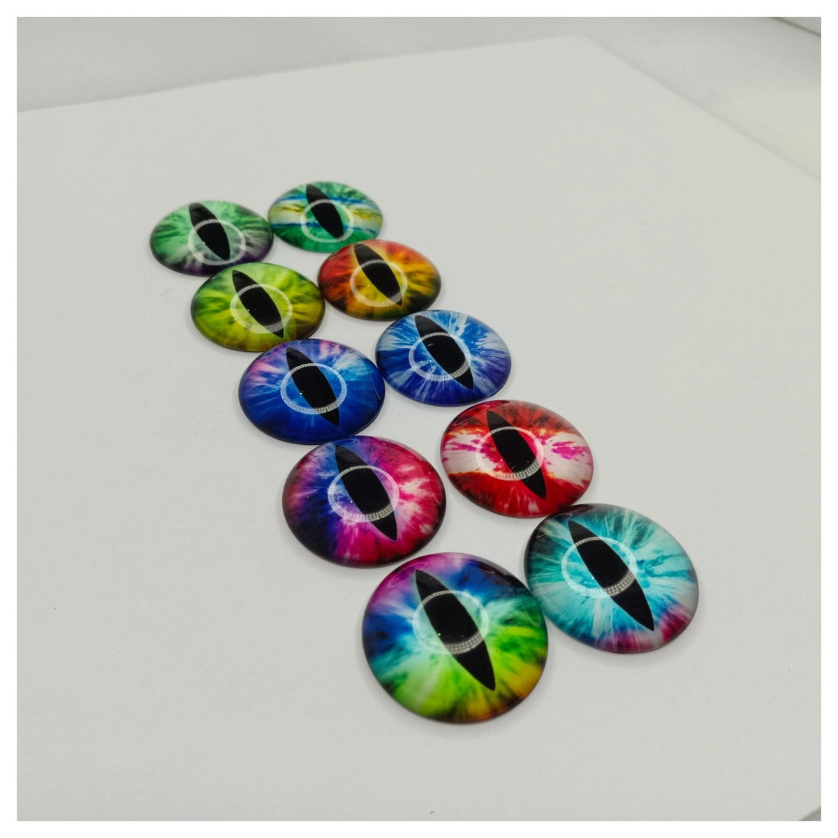 10pcs 35mm Glass Cat Doll Eyes – Mixed Rainbow Tiger Designs – Colorful dragon eye buttons arranged on a white surface