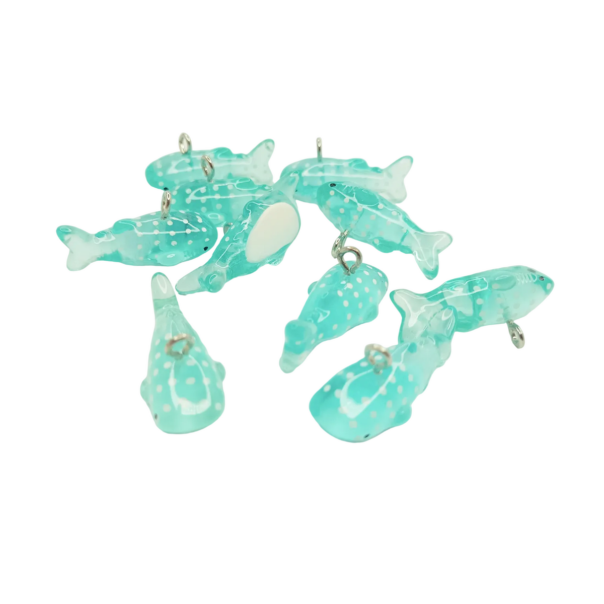 10 × 28 mm Acrylic Shark & Whale Charms – Set of turquoise dolphin-shaped charms on a white background
