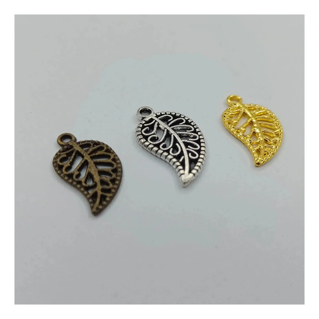 19mm Leaf Style Charms Pendant – Antique Silver, Bronze & Gold – A collection of leaf-shaped charms in gold and silver colors with intricate patterns, intended for use in crafting jewelry such as bracelets and necklaces.