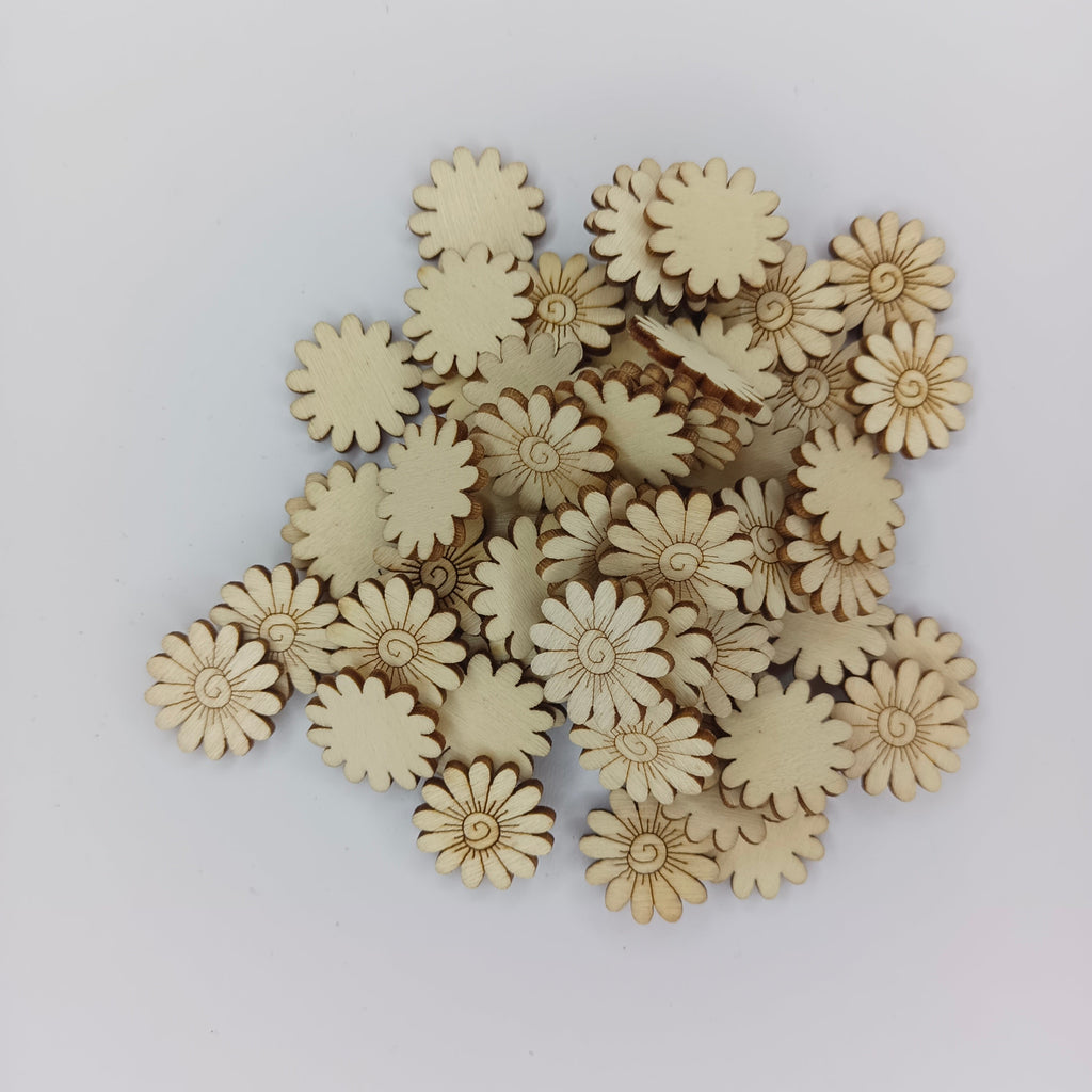 20mm Wood Sunflower Embellishments – A pile of small natural wood flower-shaped craft pieces on a plain light background.