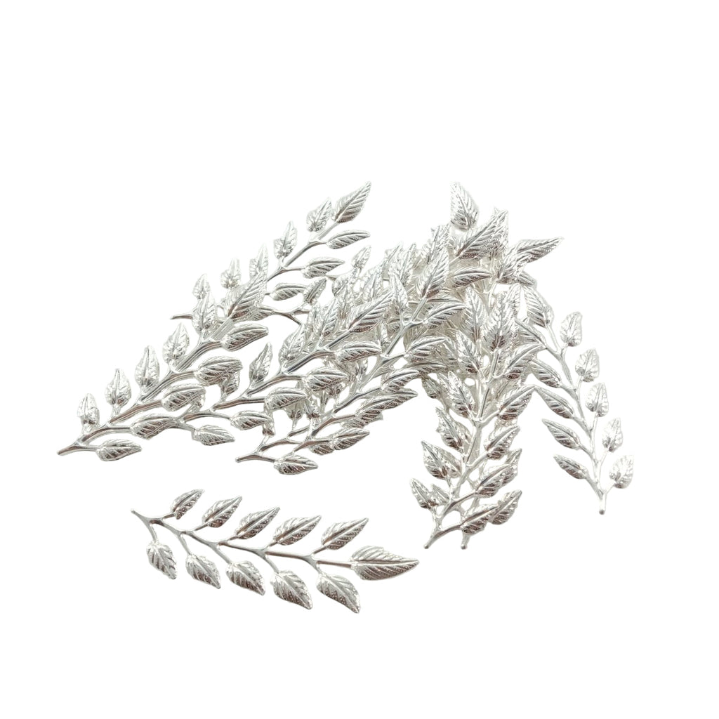 Silver leaf-shaped decorative item on a white background