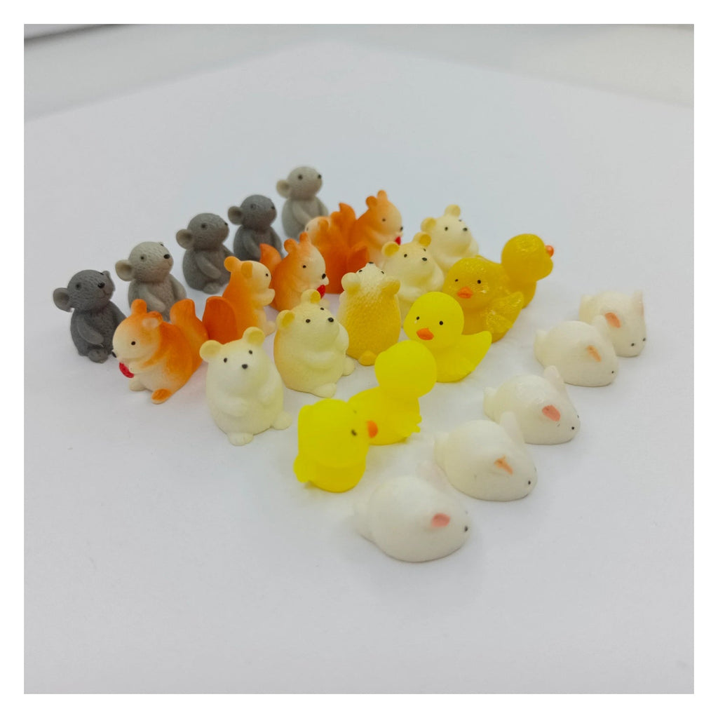 25pcs Tiny Animal Resin Figurines – Set of small animal figurines including mice, dogs, and ducks on a white background