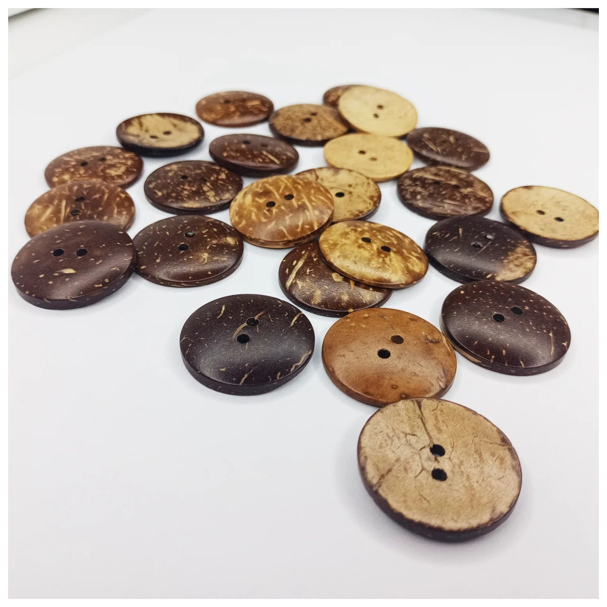 30mm Coconut Shell Round Clothing Buttons – 25pcs – Collection of coconut buttons in various shades on a white background